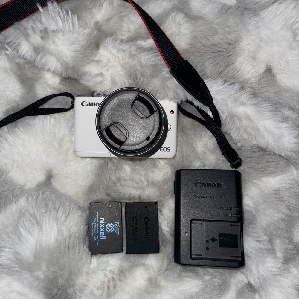 Canon White Digital Camera with Black Lens Cap